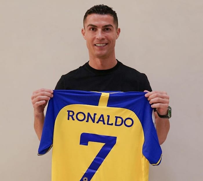 Cristiano Ronaldo pictured posing with his new Al Nassr no.7 jersey after signing for the Saudi Pro League club